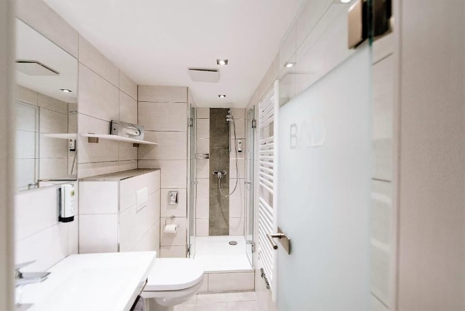 Shower, eco-friendly toiletries, hair dryer, towels