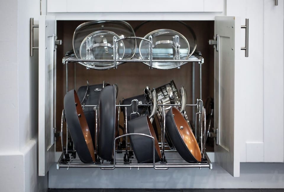 Our kitchen's open shelves celebrate both form and function, displaying cookware essentials.