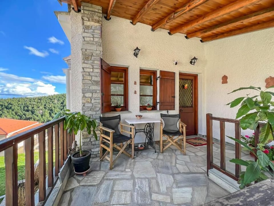 Charming Stone Balcony with Outdoor Dining Area