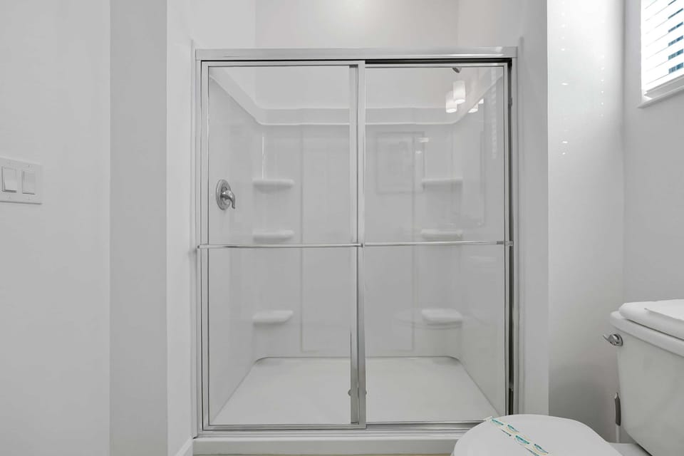 Enjoy a crisp, clean walk-in shower experience with modern fixtures.