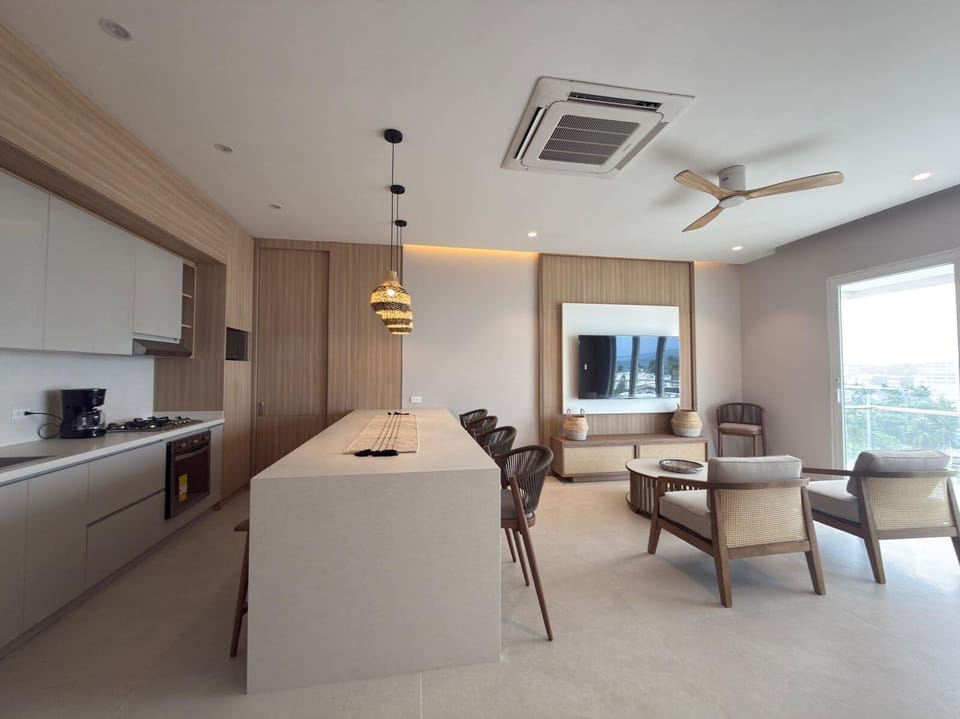 Deluxe Apartment, Balcony, Sea View | Living area | Flat-screen TV