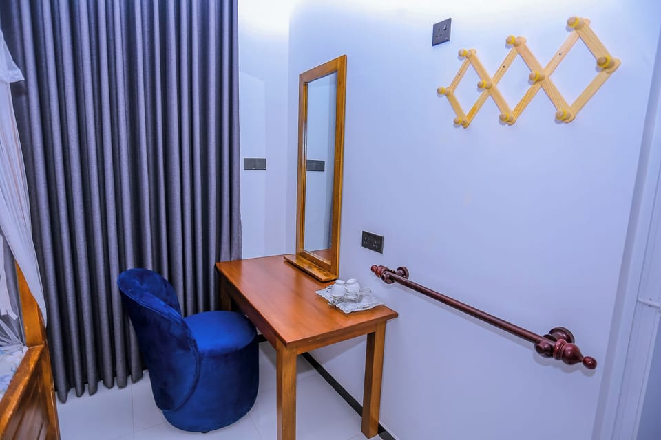 Deluxe Triple Room, Garden View | Desk, laptop workspace, free WiFi