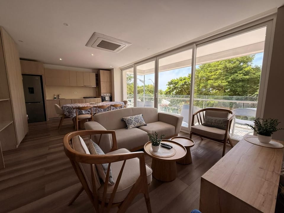Deluxe Apartment, Balcony | Living area | Flat-screen TV