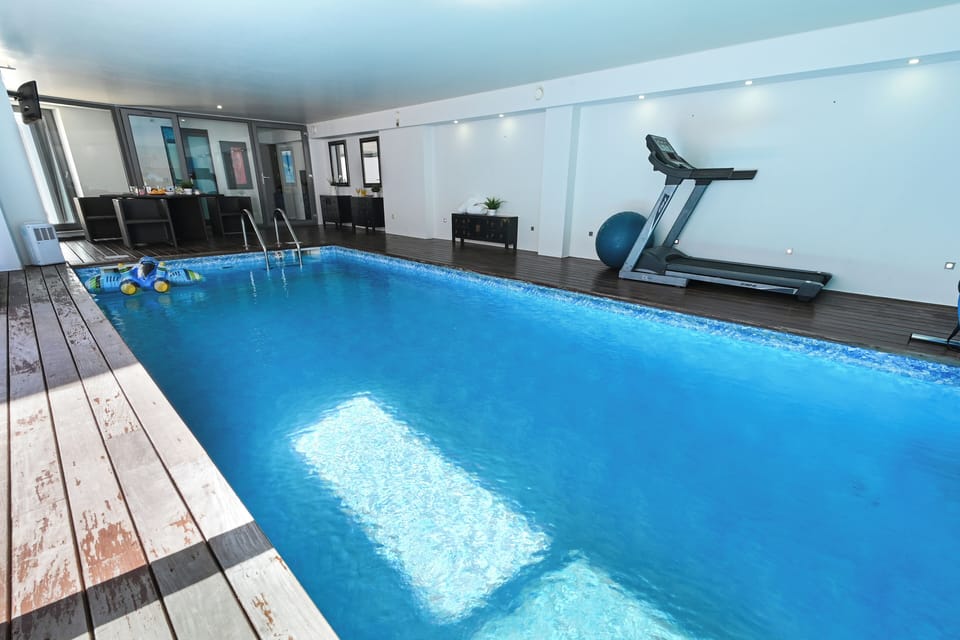 Indoor pool, pool umbrellas, sun loungers