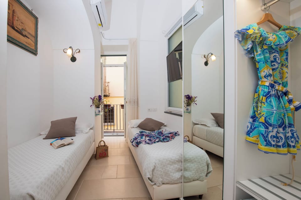 Family Studio Suite, 1 Bedroom, Balcony, City View | Frette Italian sheets, premium bedding, down comforters, pillowtop beds