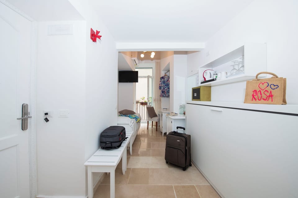 Family Studio Suite, 1 Bedroom, Balcony, City View | Frette Italian sheets, premium bedding, down comforters, pillowtop beds