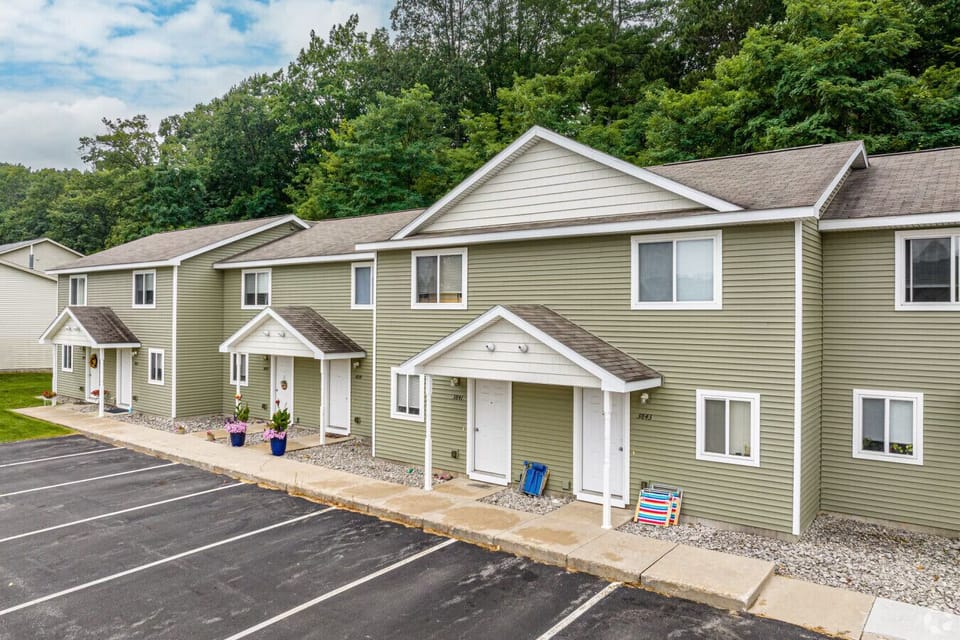 Holiday Village Townhomes welcome you with easy parking and that laid back up north feel