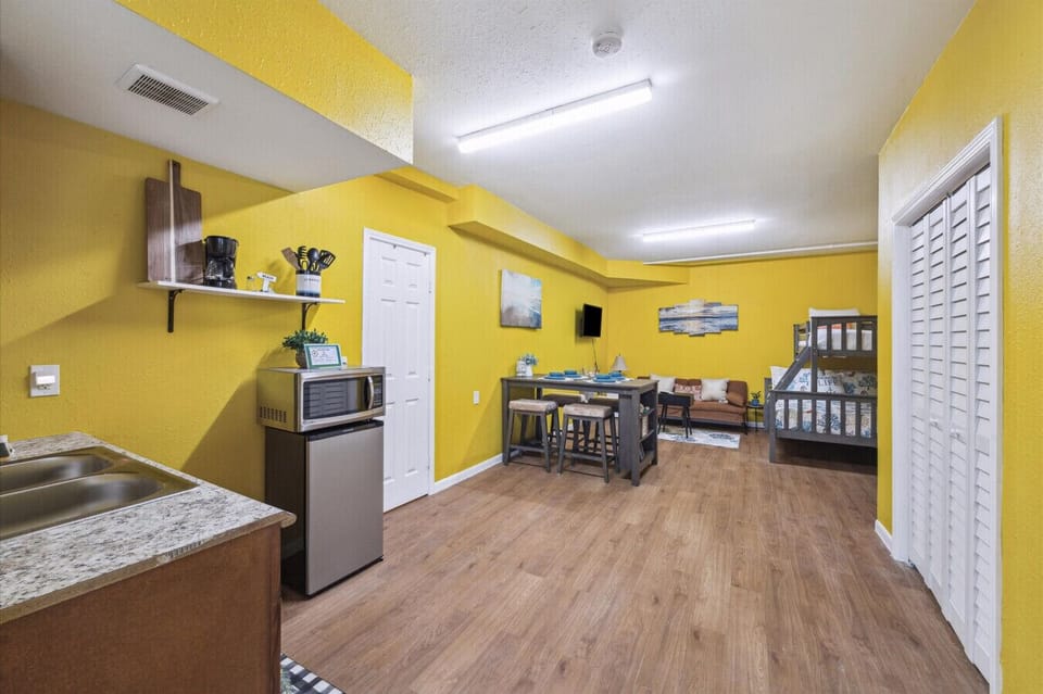 The kitchenette comes equipped with a microwave, mini-fridge, and coffee station