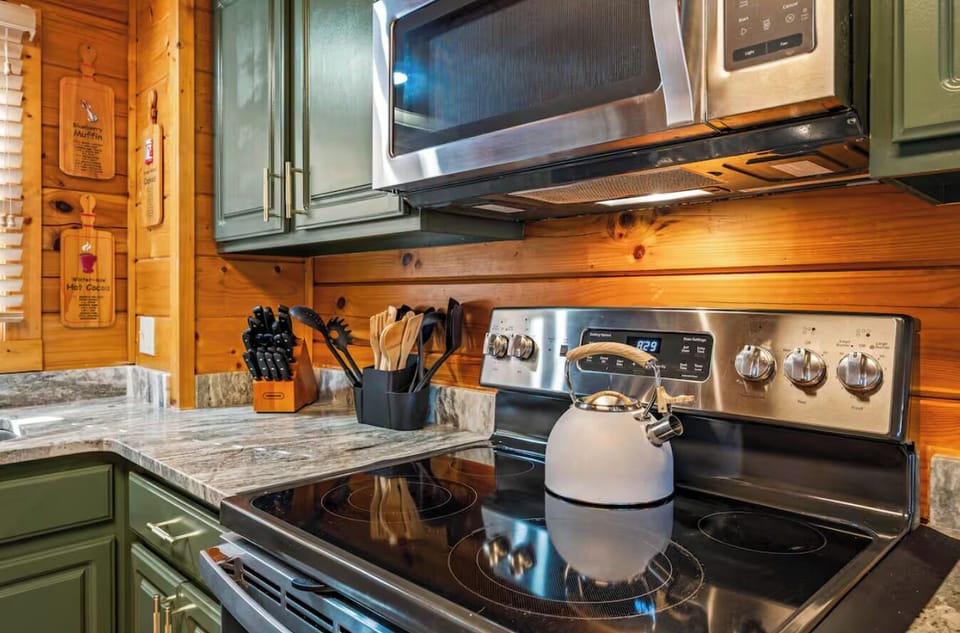 Modern stainless steel appliances and granite countertops.