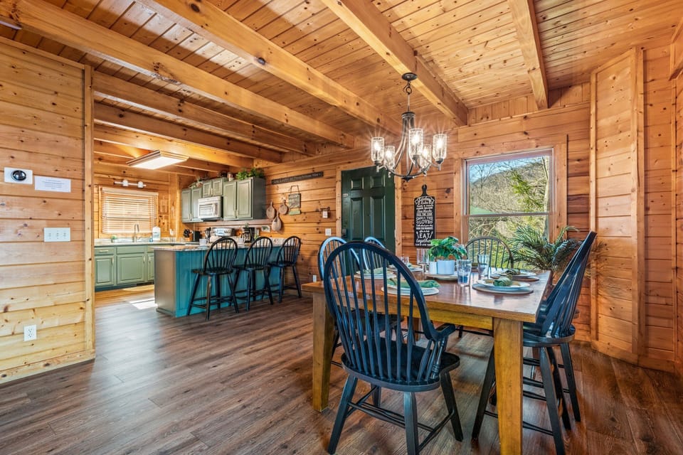 Seating for 6 plus 3 at the kitchen bar. Open floor plan.