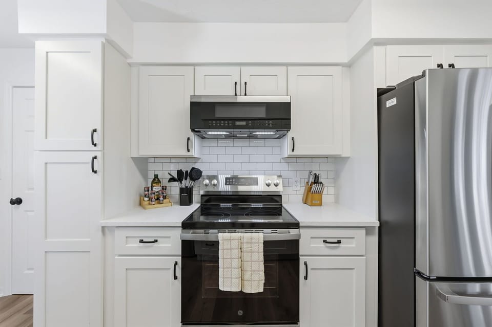 Warning: Kitchen may inspire spontaneous cooking competitions. Fully stocked, stylish, and begging for your inner chef (or just your love of takeout).