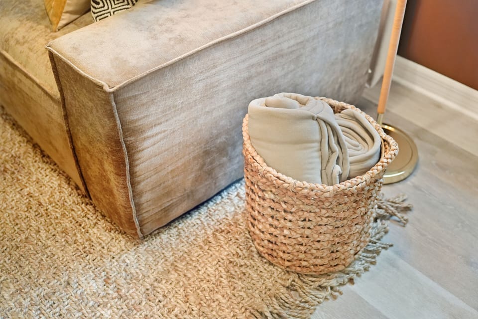 Throw blankets in the basket for the living room