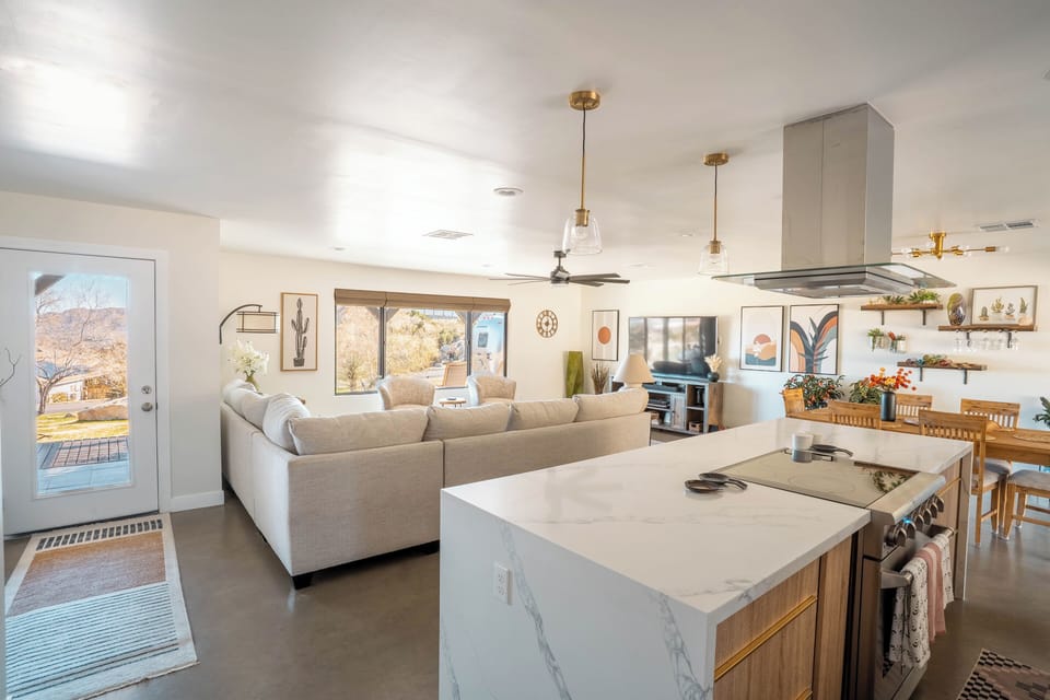 Open concept living with a large comfortable couch.  Room for everyone!