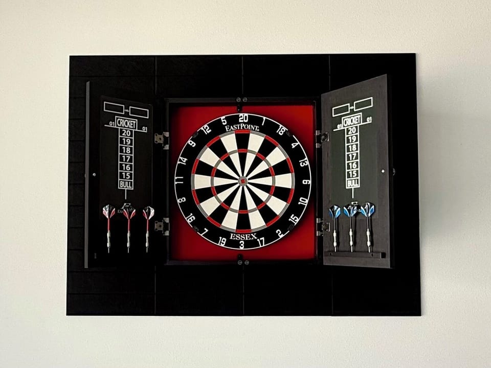 Unwind with a classic game of darts after a day at the beach 🎯