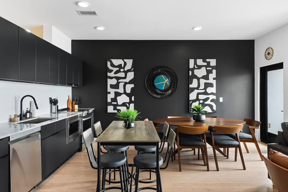 Fully equipped kitchen, high-top table with seating for 4, and a charming dining table with seating for 6. All with a view of the Cumberland River.