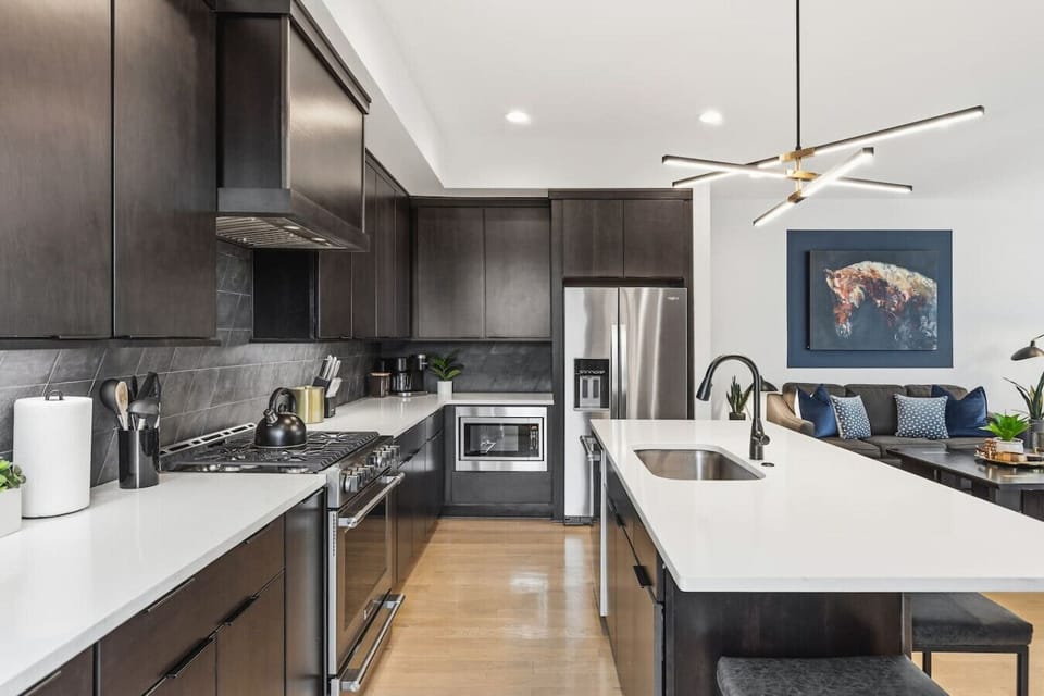 Spacious, fully-equipped kitchen for all your cooking needs. Modern appliances and a large kitchen island with seating for 4.