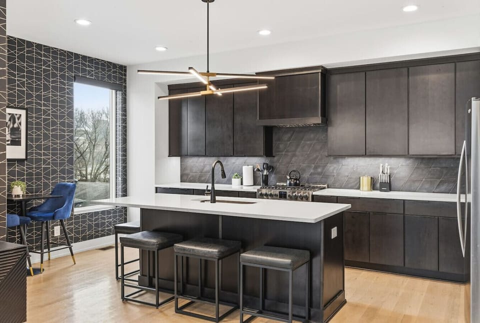 Spacious, fully-equipped kitchen for all your cooking needs. Modern appliances and a large kitchen island with seating for 4. Hightop round table with seating for 2.