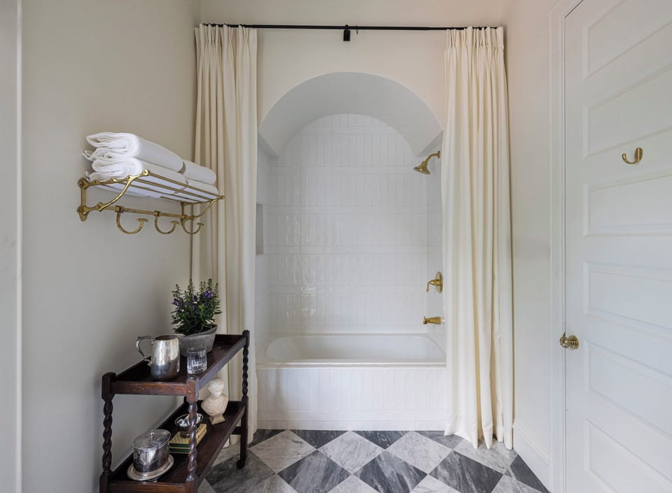 Nanette Suite | Bathroom | Hair dryer, towels, soap, shampoo