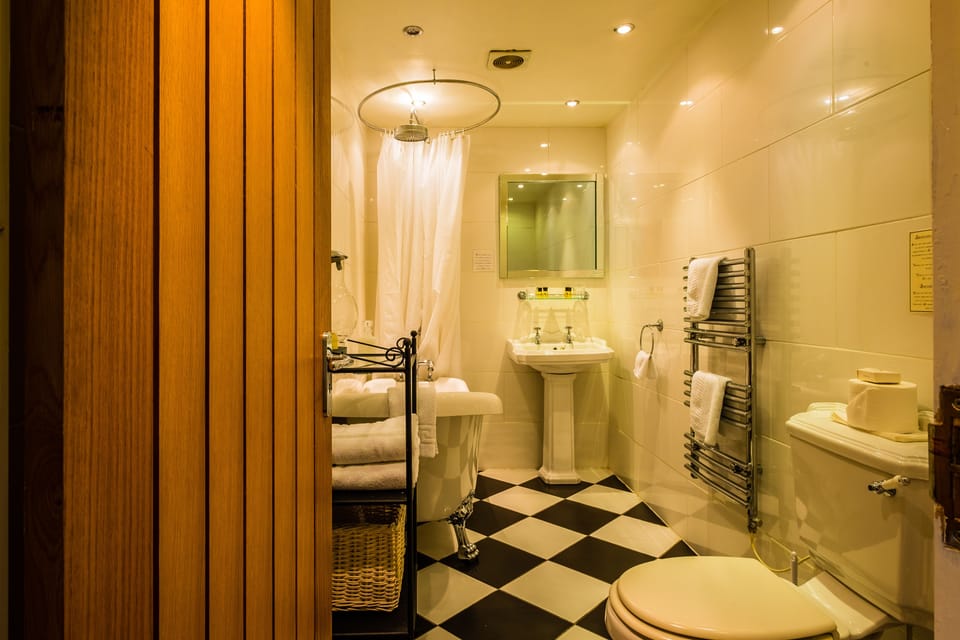 Designer toiletries, hair dryer, towels
