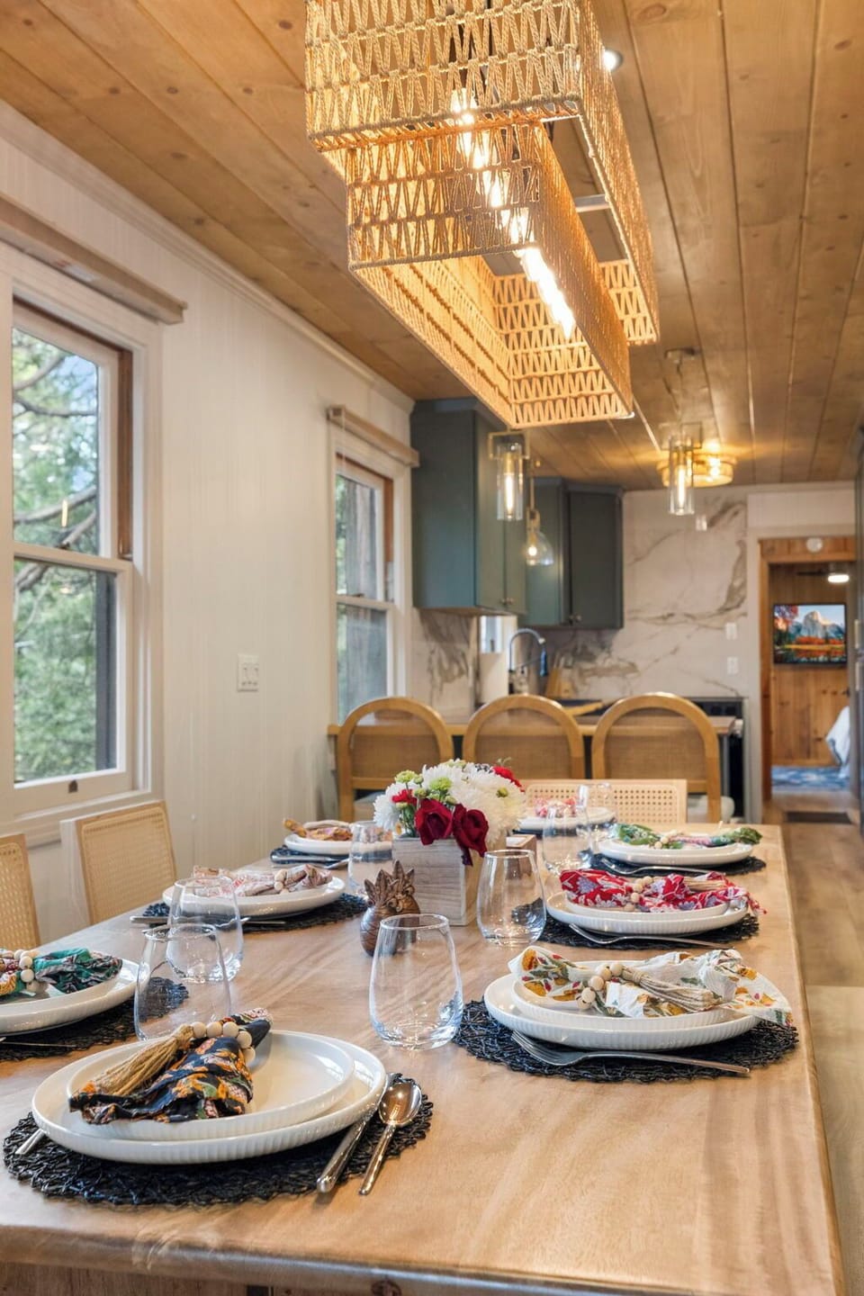 Dining table for up to 10. Up to 6 chairs and a large bench is available for seating. Plenty of dishes for your large groups as well.
