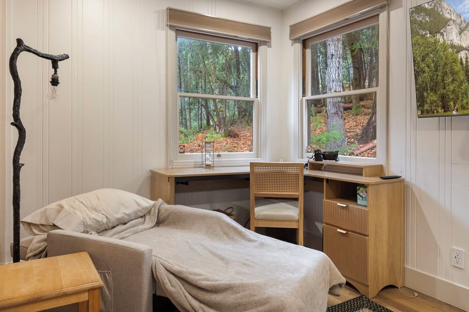 Childs sleeping area on pull out chair in master bedroom.