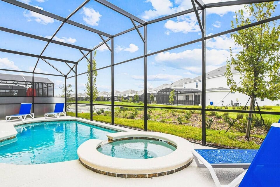 Relax and unwind by the sparkling pool and hot tub, the perfect oasis for a refreshing dip or a soothing soak