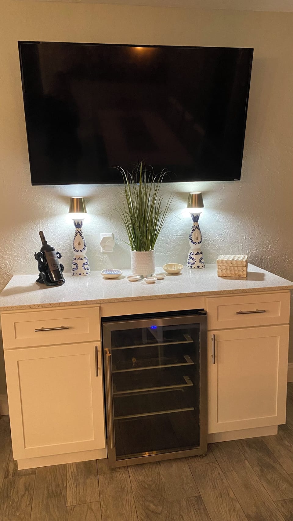 The dining room has a smart TV and a wine refrigerator.