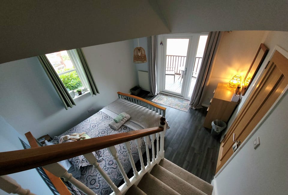 Langunnett Cottage, Looe. First Floor: Bedroom two with access to the balcony