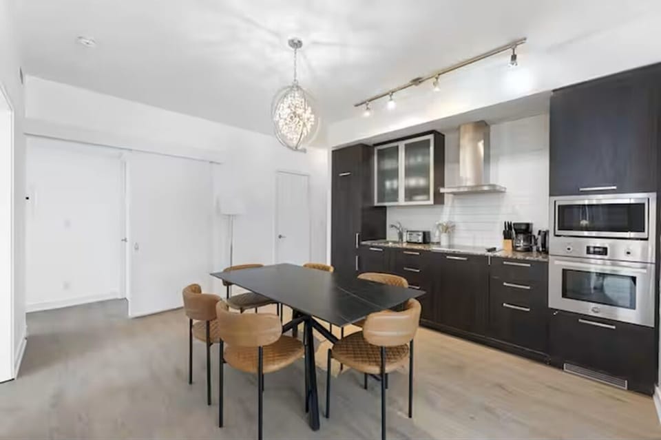 Family Suite, 3 Bedrooms, Balcony, City View | Private kitchen | Fridge, microwave, oven, stovetop