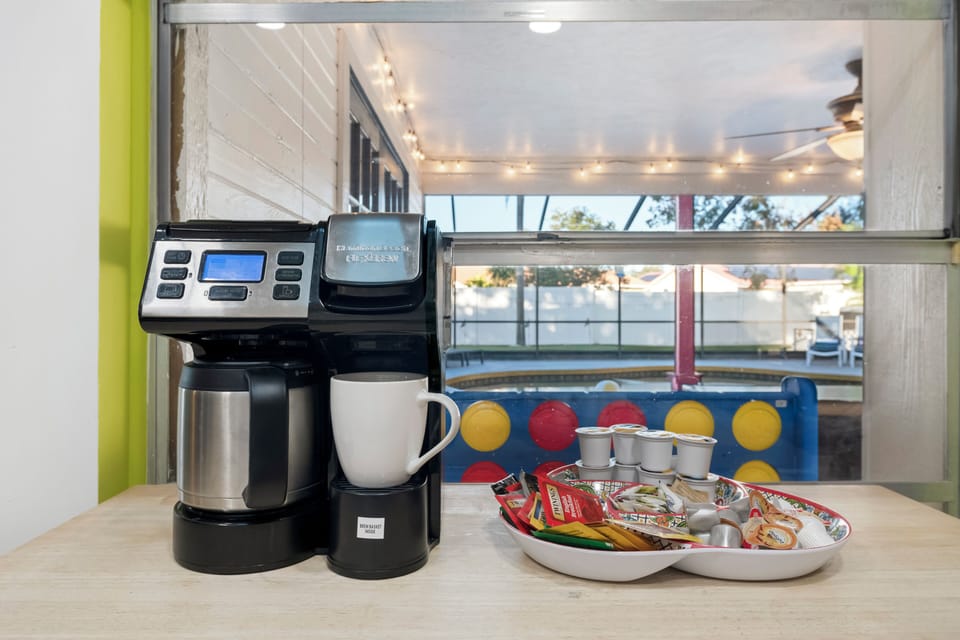 Morning coffee & snacks with cheerful poolside views.