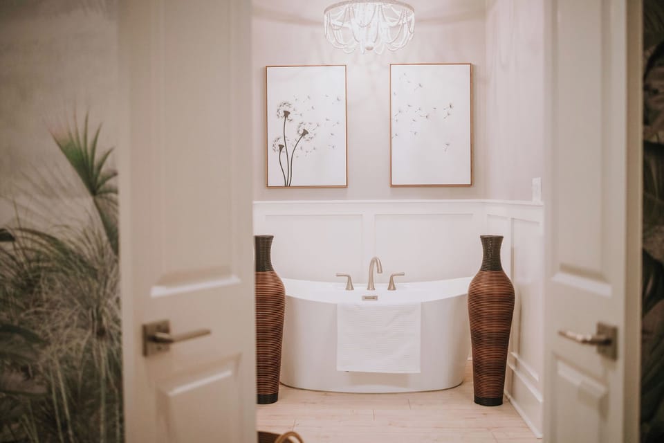 Master bathroom soaking tub with complimentary bath salts.