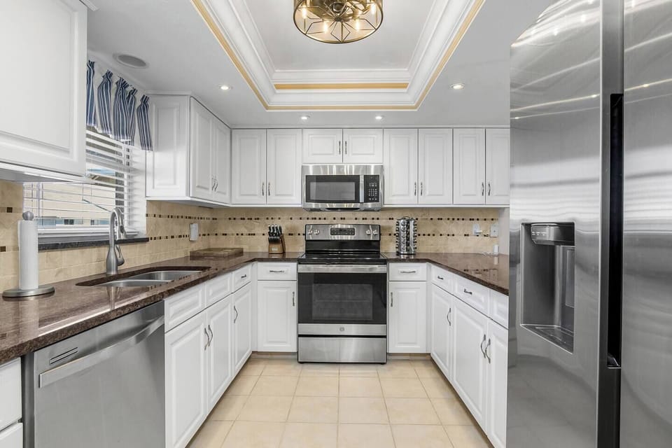 Fully equipped kitchen with stainless appliances and everything you need to cook at home.