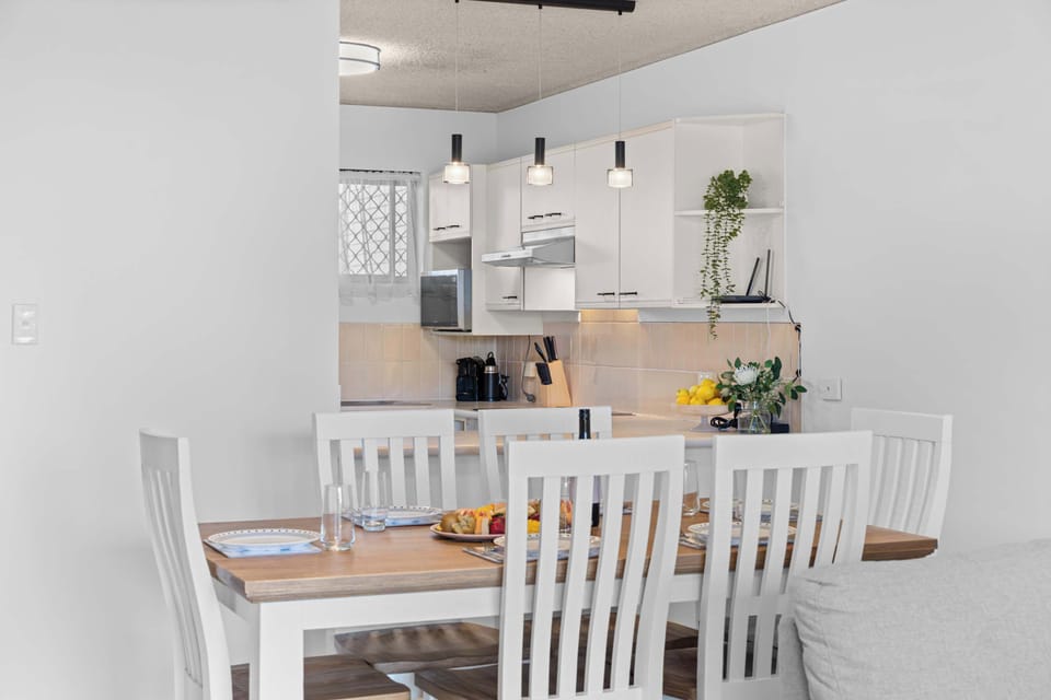 Share meals at the dining table for six after days spent exploring the riverside paths and nearby coastal spots.