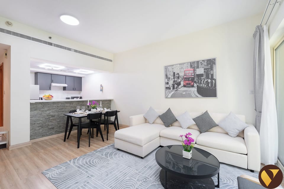Luxury Apartment, Balcony, Garden View | Living room | 65-inch Smart TV with cable channels