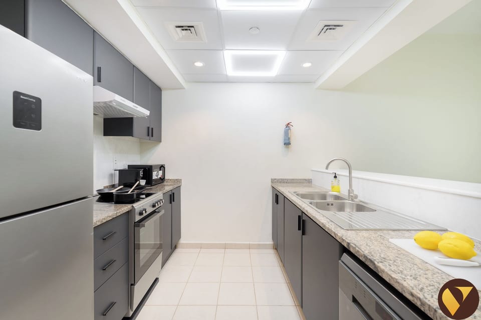 Luxury Apartment, Balcony, Garden View | Private kitchen | Full-size fridge, microwave, oven, stovetop
