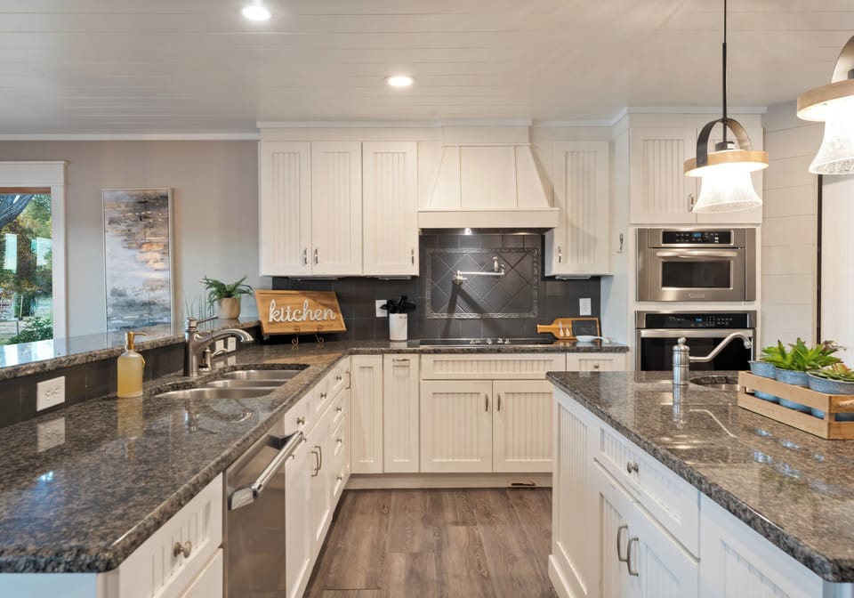 Fully stocked kitchen with reliable appliances and ample counter space.