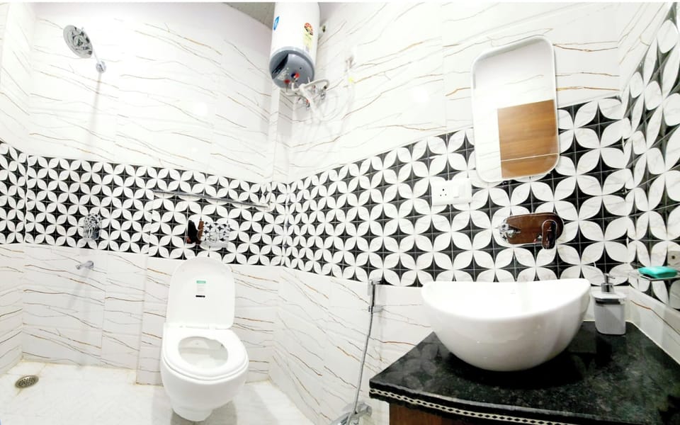 Shower, rainfall showerhead, slippers, towels
