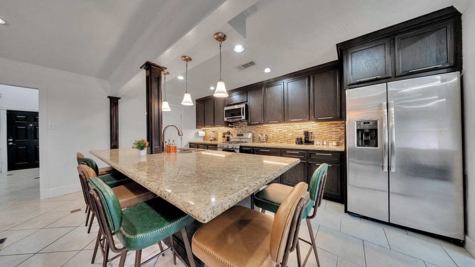Island seating keeps everyone connected while meals are being prepared.