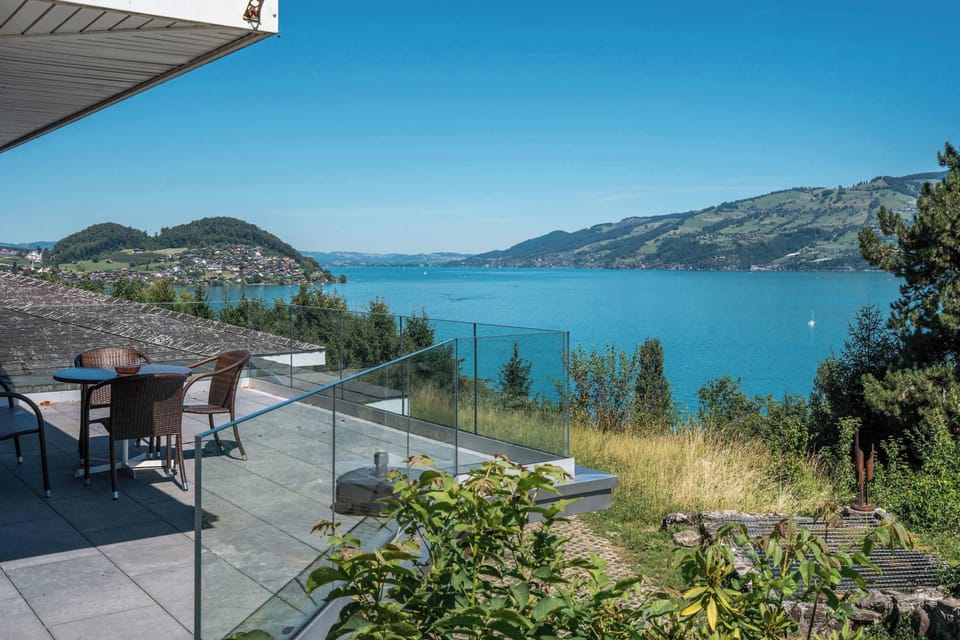 Panoramic lake view from the villa overlooking beautiful Lake Thun and the Bernese Alps.
