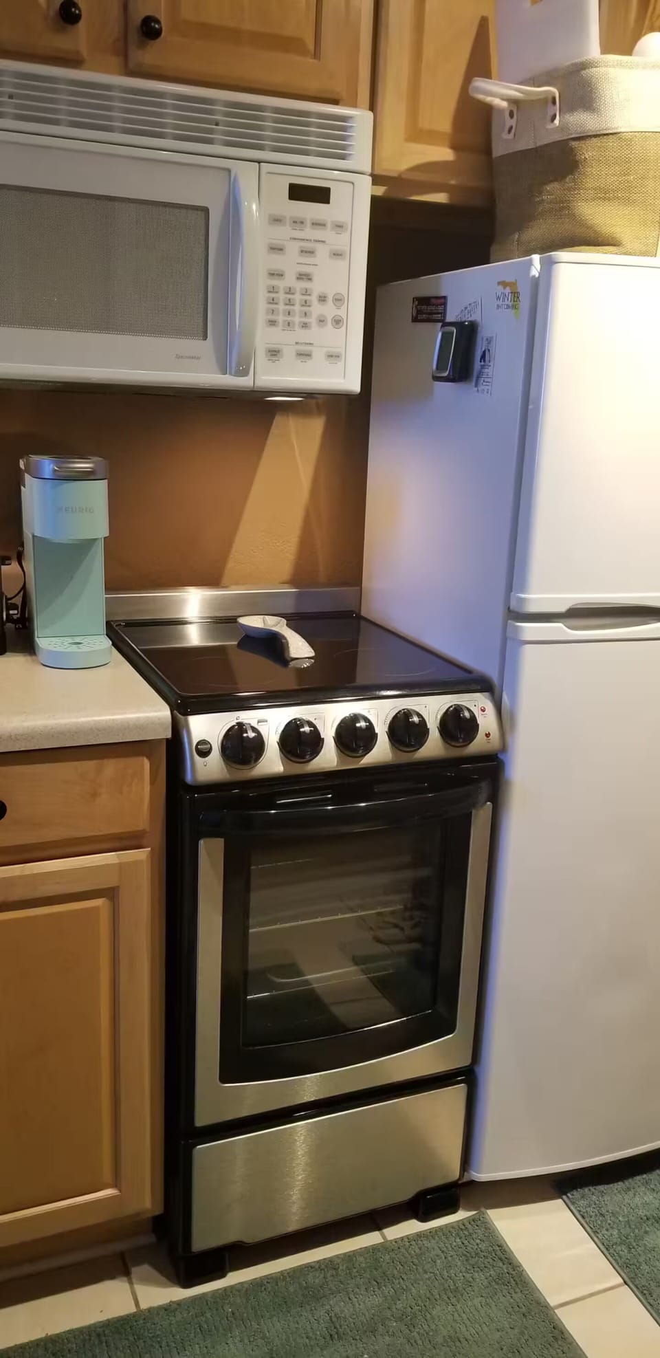 Galley kitchen with new stove.
