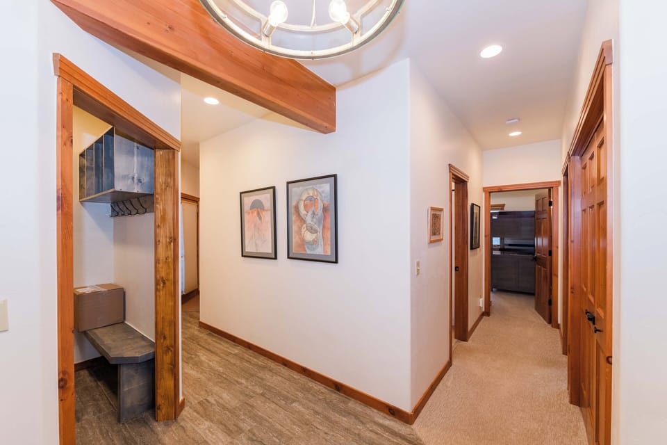 Step into your welcoming hallway with beautiful wood accents, artwork, and a stunning skylight that fills the space with natural light.