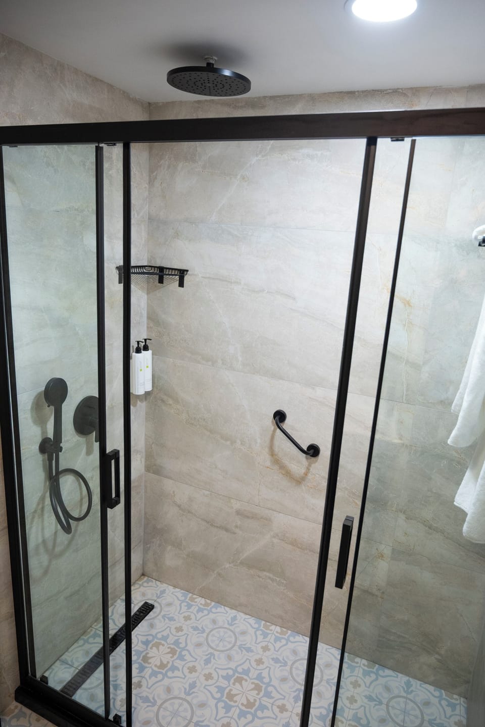 Shower, hair dryer, slippers, towels