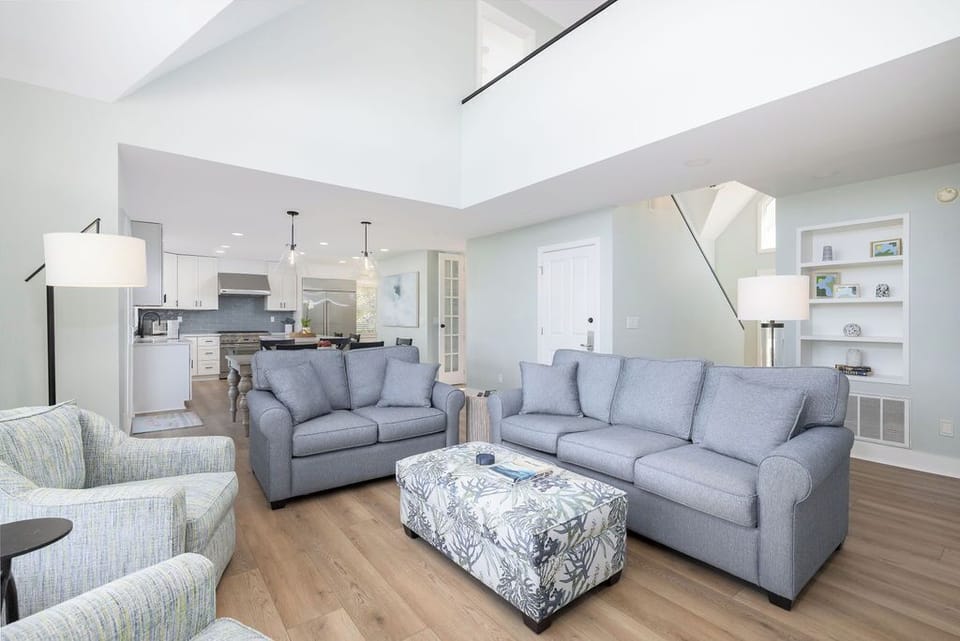 Unwind in your bright, open living area that flows into the dining room and kitchen.