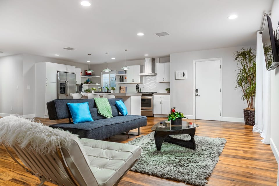A bright open-concept kitchen and living space, perfect for cooking, relaxing, and entertaining together.