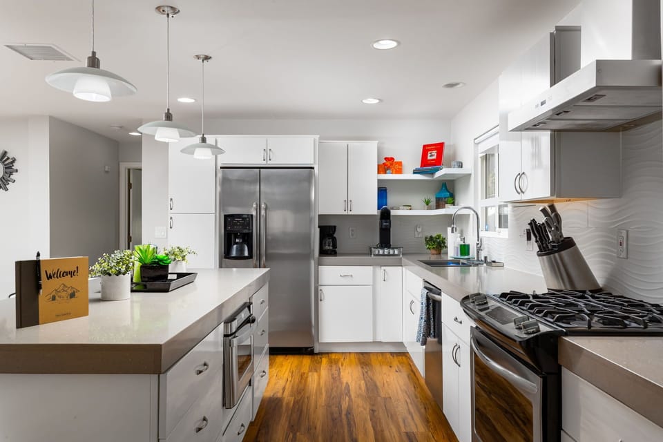 Kitchen features cooking basics and stainless steel appliances.