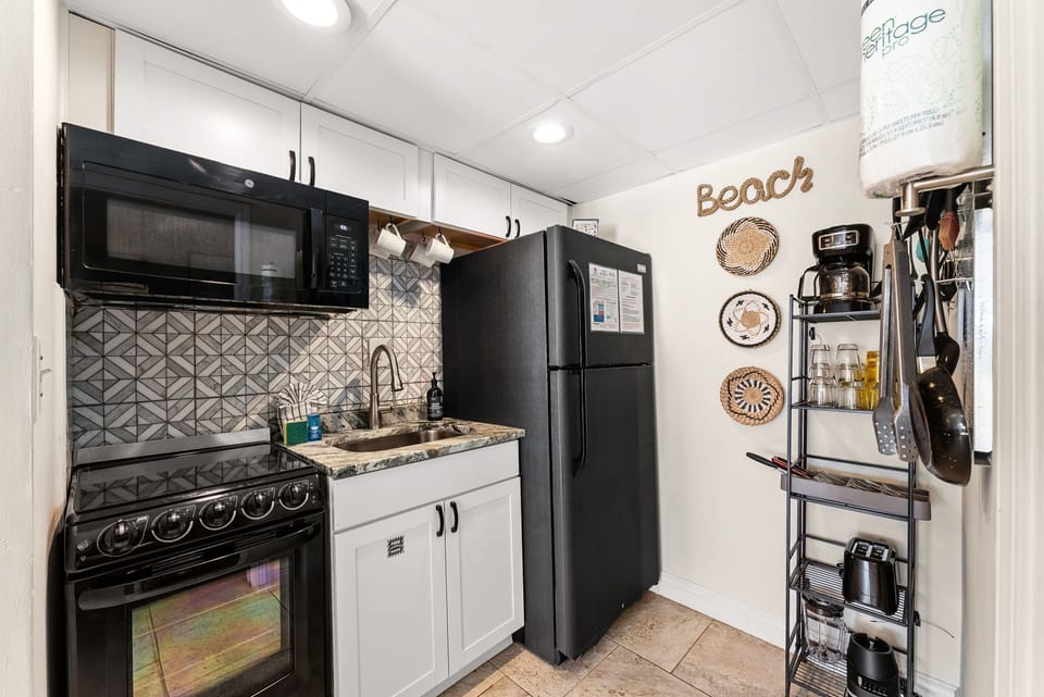 Your beach-themed kitchen awaits with modern appliances and charming coastal touches for creating memorable meals.
