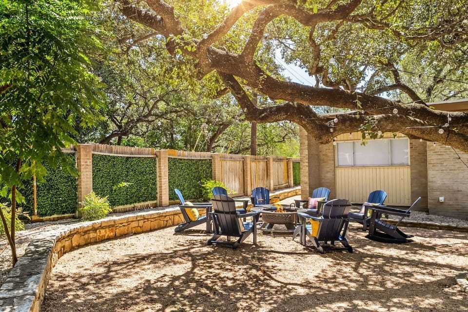 Open courtyard gathering space with comfortable chairs, perfect for groups to unwind outdoors.