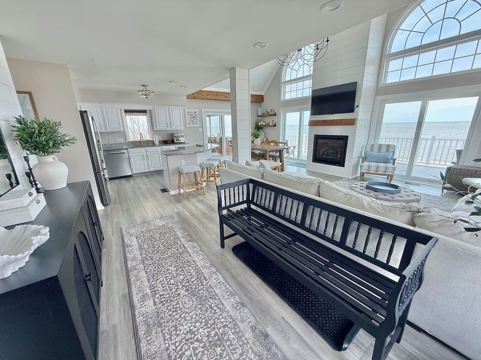 Enjoy luxury living in this spacious, open-concept floor plan. Featuring a gourmet kitchen, cozy seating area, and breathtaking ocean views through large windows, it is designed for effortless coastal elegance.