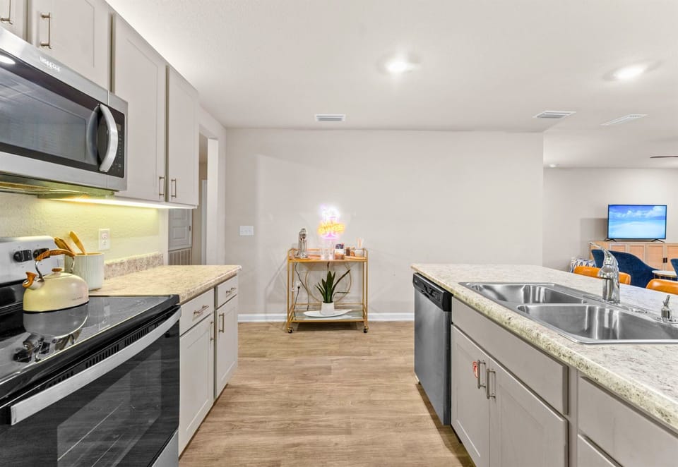 A closer look at the kitchen shows modern finishes and everything you need to cook, serve, and gather with ease.