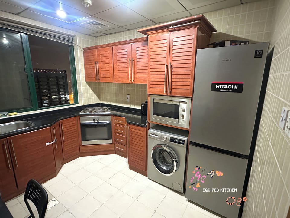 Economy Double Room, Balcony, City View | Shared kitchen | Fridge, microwave, stovetop